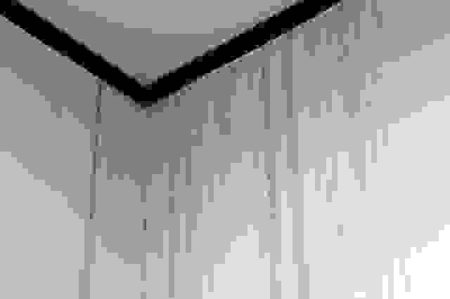 Water flowing from the ceiling.Water marks flow from the edge of the ceiling to the wall. Rainy days, dirty walls, dirty Water flowing from the ceiling.Water marks flow from the edge of the ceiling to the wall. Rainy days, dirty walls, dirty
